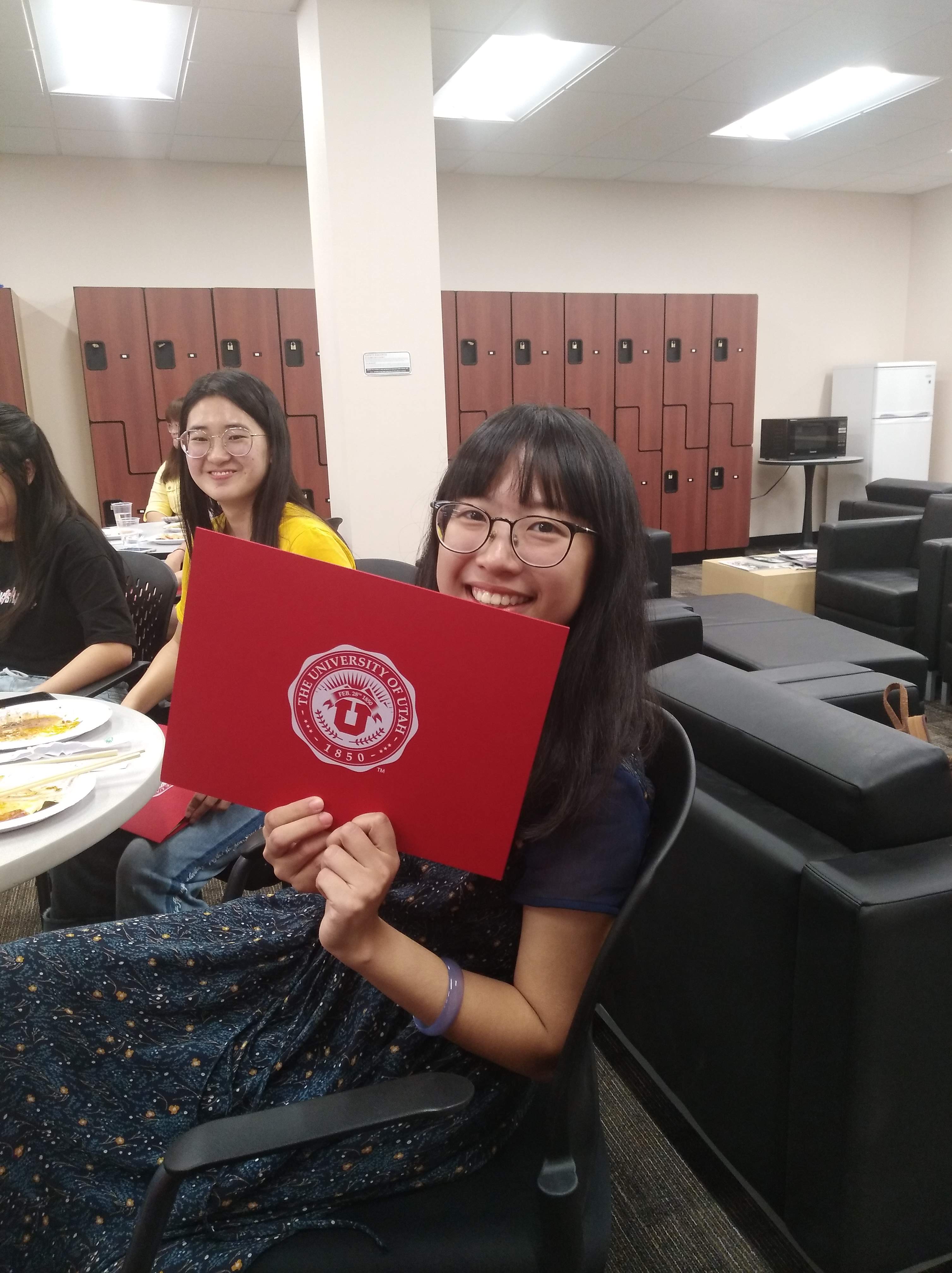 Student showing her certificate of completion.